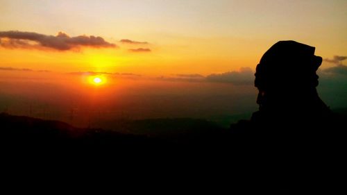 Silhouette of man at sunset