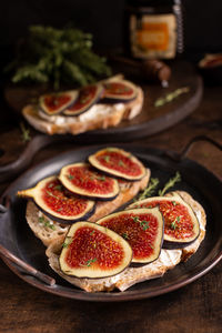 Sweet bruschetta with cream cheese and figs for breakfast