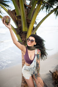 Woman wearing sunglasses at beach