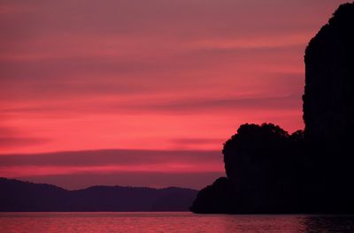 Scenic view of sea against orange sky