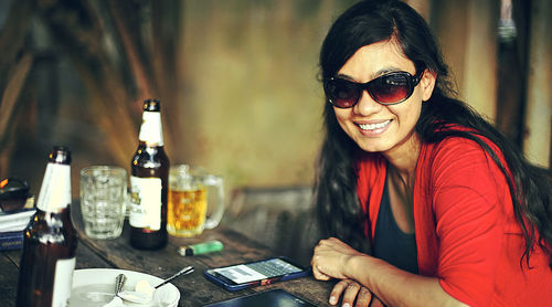 Woman photographing through smart phone