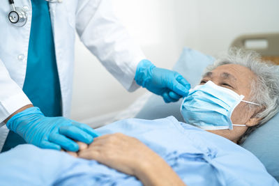 Doctor examining patient in clinic