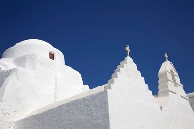 Low angle view of temple against clear blue sky