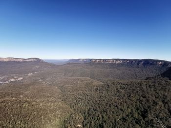 Scenic view of landscape against clear blue sky