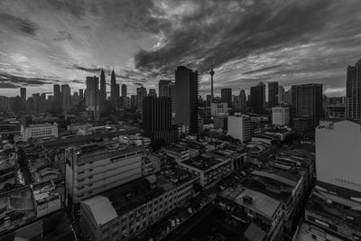 High angle view of buildings in city against sky