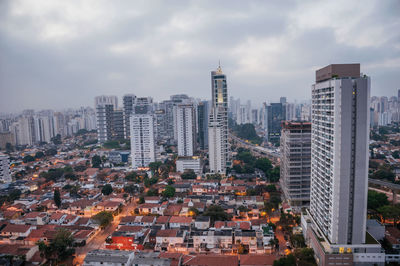 Modern buildings in city against sky