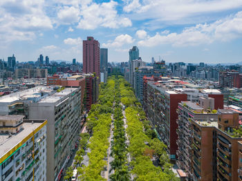 High angle view of buildings in city against sky