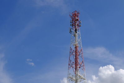 Low angle view of communications tower against sky