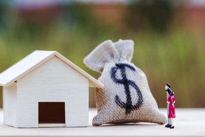 Close-up of small stuffed toy against building