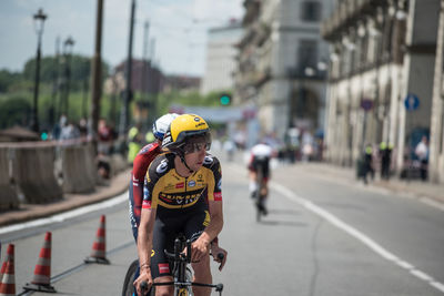 Man riding bicycle on city street