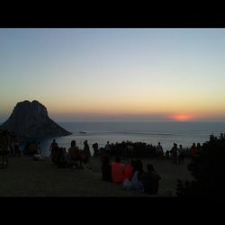 People on beach at sunset