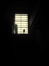 Silhouette woman in dark background