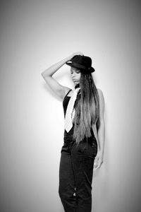 Woman standing against white background