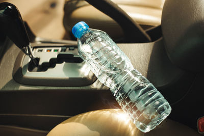 High angle view of water bottle in car