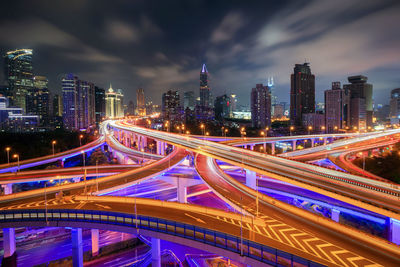 Illuminated modern buildings in city at night