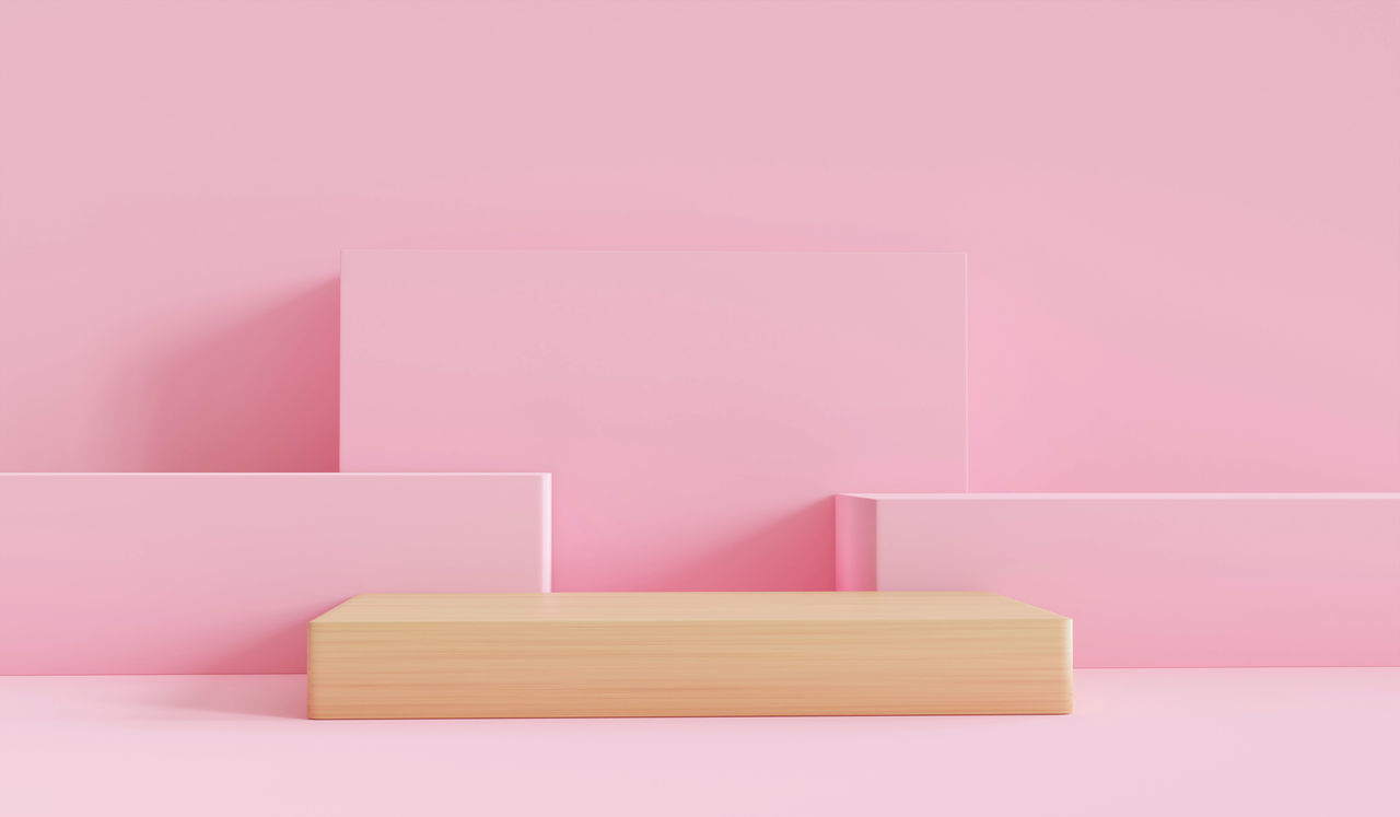 CLOSE-UP OF EMPTY ROOM AGAINST PINK BACKGROUND