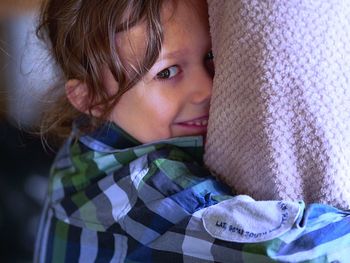 Close-up portrait of cute girl at home