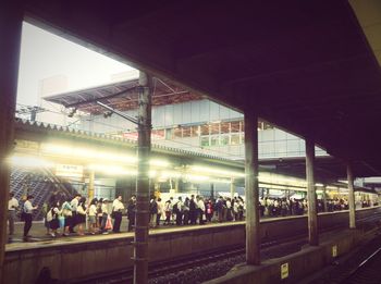 People at railroad station platform