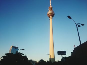 Low angle view of building against cloudy sky