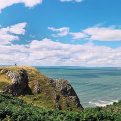 Scenic view of sea against cloudy sky