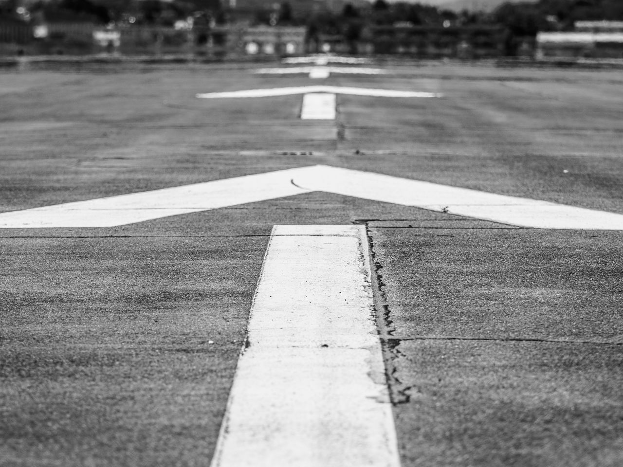 sign, white, symbol, road, road marking, asphalt, marking, lane, black and white, transportation, road surface, monochrome, infrastructure, no people, guidance, day, pedestrian crossing, line, monochrome photography, tarmac, city, black, communication, arrow symbol, outdoors, zebra crossing, road sign, street, nature