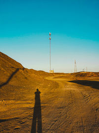 Shadow of person on desert land