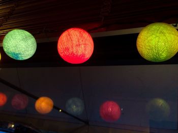 Low angle view of multi colored balloons