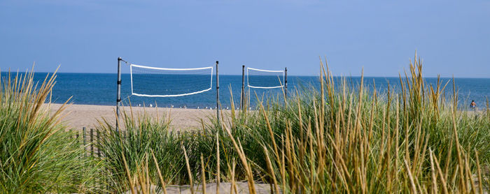 Empty beach volleyball nets on the lakeshore