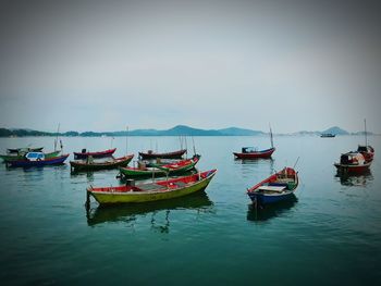 Boats moored in sea