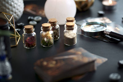 Blurred esoteric magic objects tarot cards on witch table altar