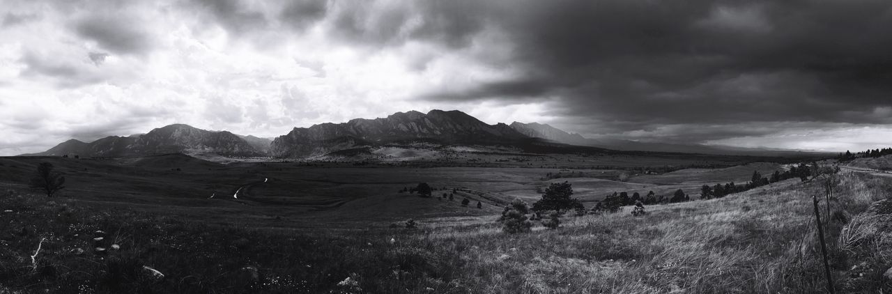 sky, mountain, landscape, tranquil scene, tranquility, cloud - sky, scenics, cloudy, mountain range, beauty in nature, nature, non-urban scene, cloud, grass, remote, physical geography, overcast, idyllic, weather, geology