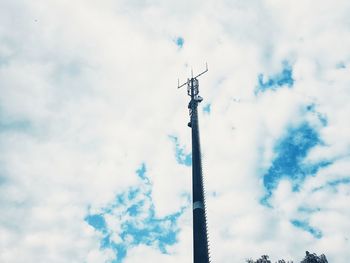 Low angle view of communications tower against sky