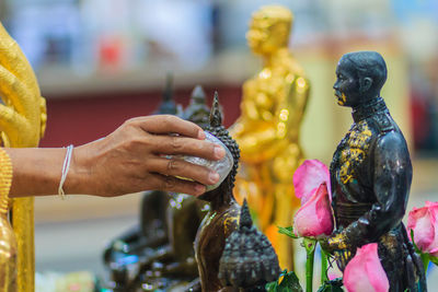 Close-up of statue of buddha against temple