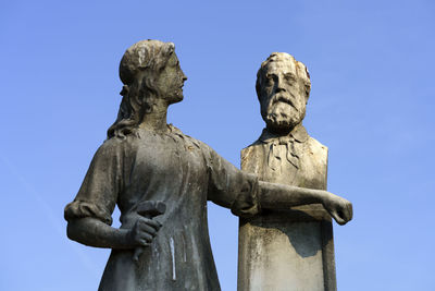 Low angle view of statue against sky