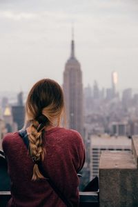 Woman looking at cityscape