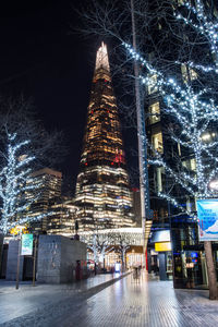 Illuminated buildings in city at night