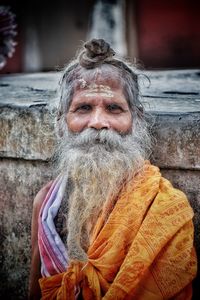 Close-up portrait of monk with beard at temple