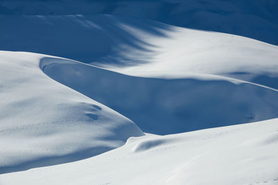 Winter landscape with snow banks, on a sunny day after a blizzard