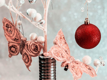 Close-up of christmas decorations hanging on tree