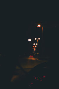 Illuminated lights seen through car windshield