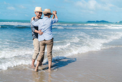 Full length of man standing at beach