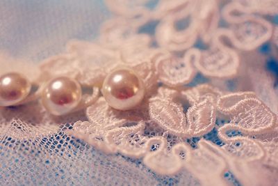 Close-up of pearl on lace