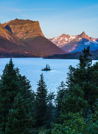 Scenic view of lake and mountains against sky