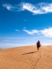 Full length of man on desert against sky