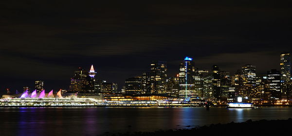 Illuminated buildings in city at night