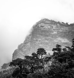 Low angle view of rock formation against sky