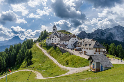 Panoramic view of buildings and mountains against sky