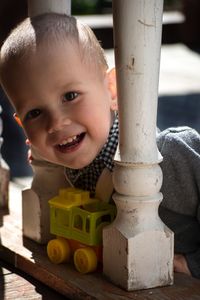 Portrait of cute boy with toy