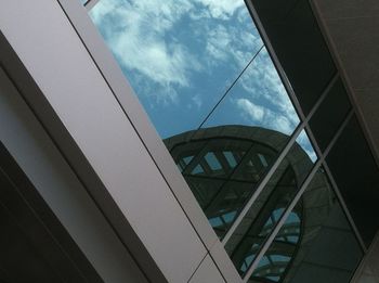 Low angle view of building against cloudy sky