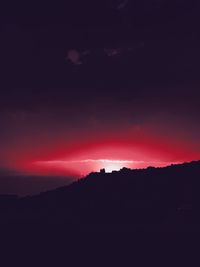 Silhouette landscape against sky during sunset